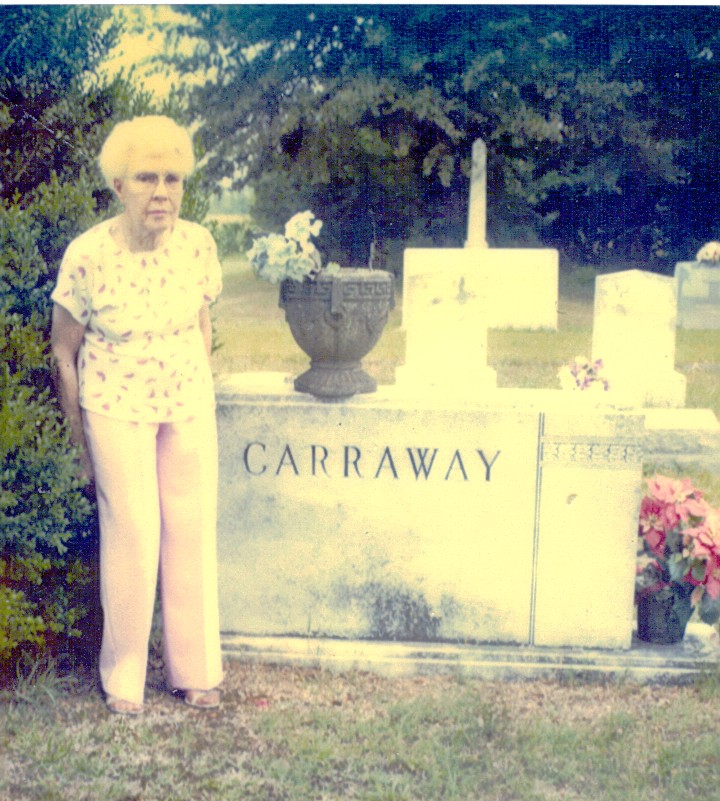 Mamie stands beside Eddie's grave in Maury Cemetery in Greene County, NC.