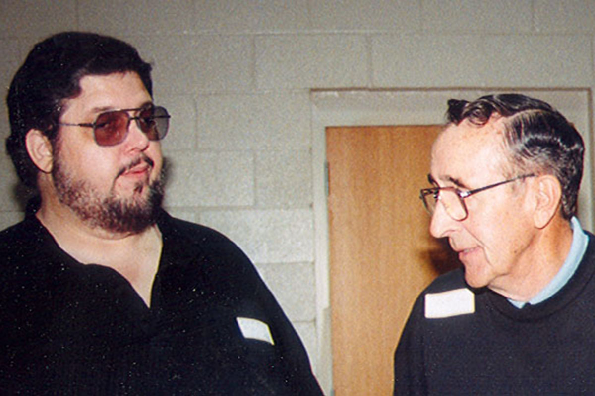 Mark Six and Walt Six visit at the 1997 Stancil Family Reunion.